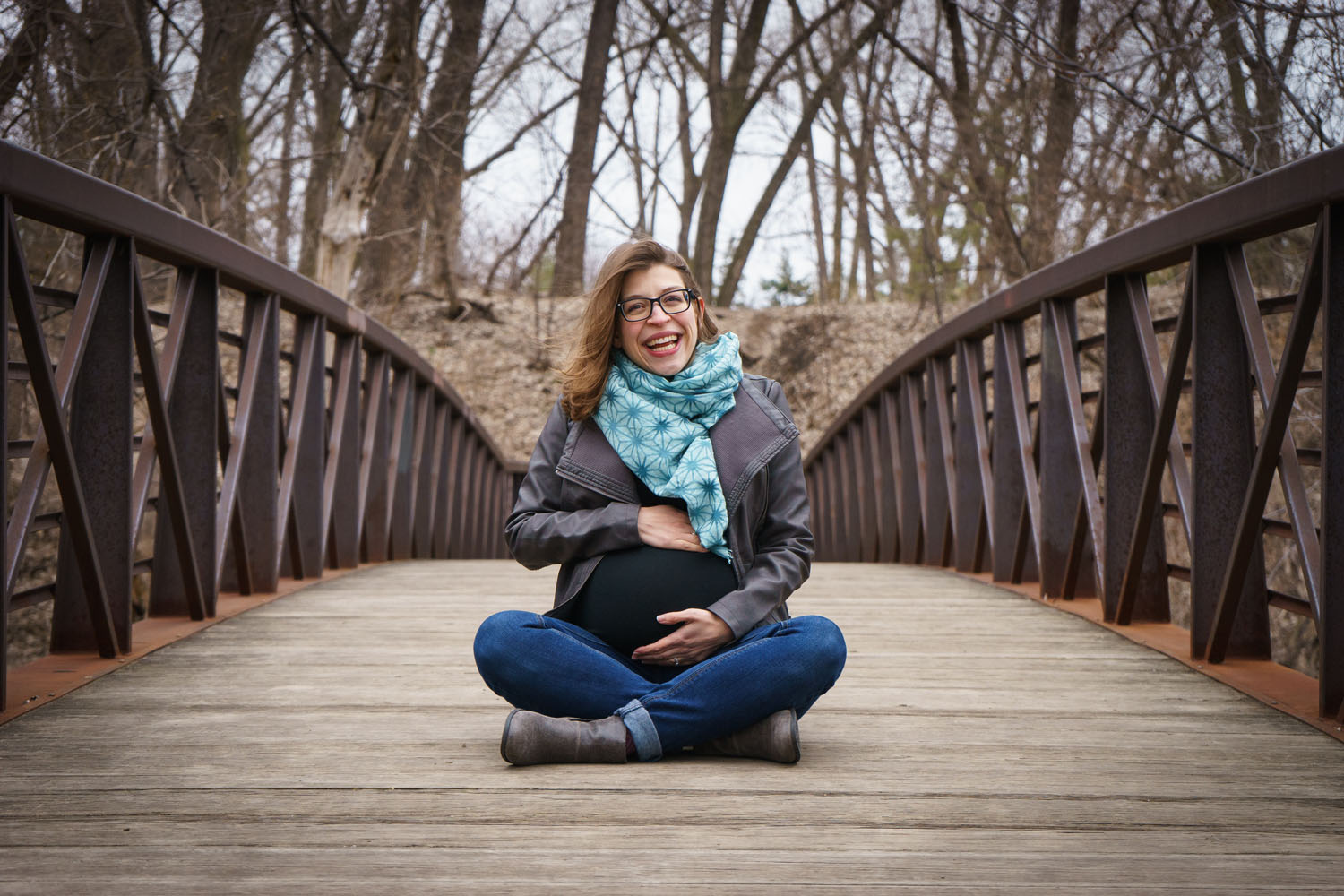 River Road Maternity Session - cross-legged bridge