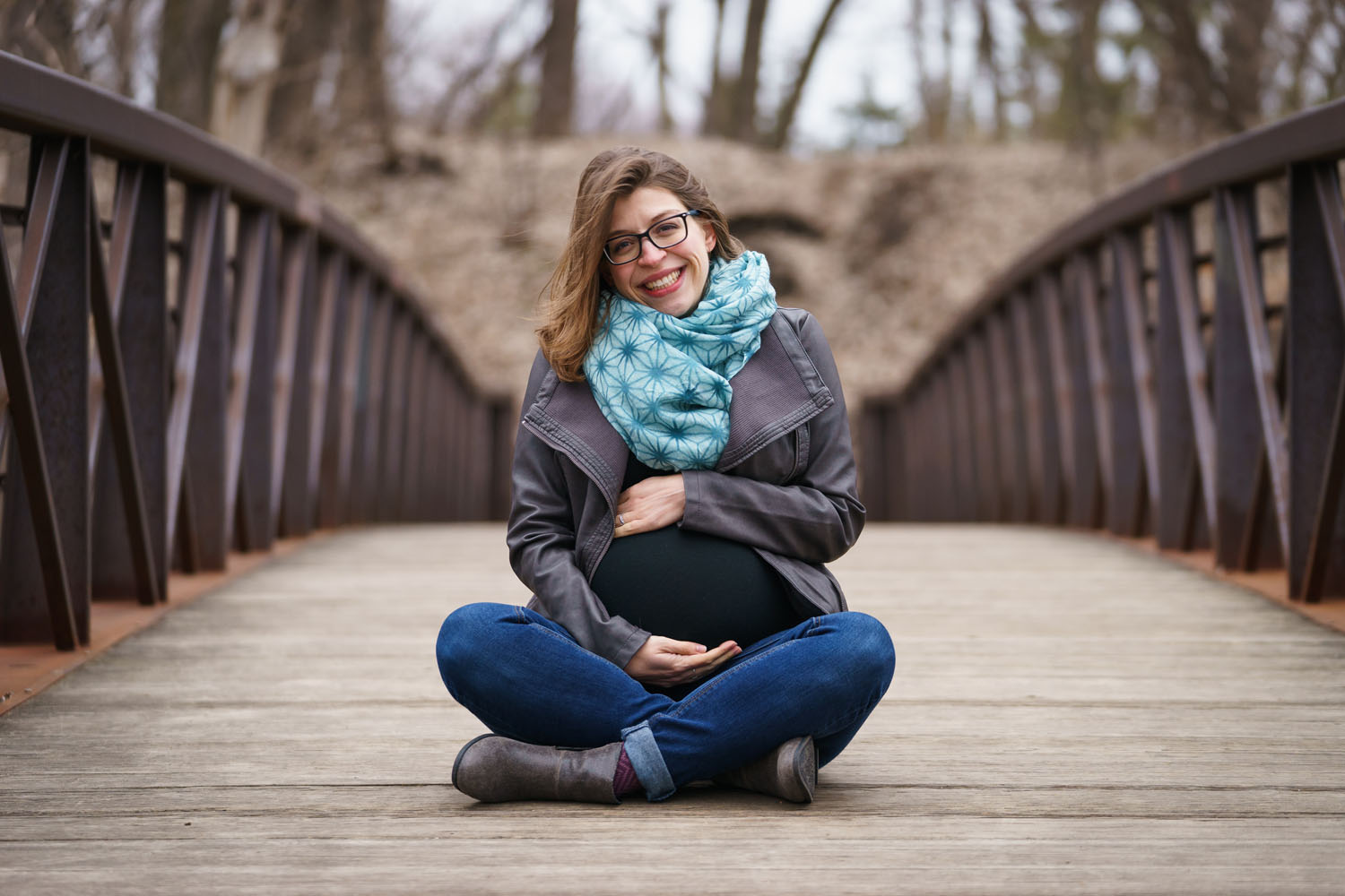 River Road Maternity Session - cross-legged bridge