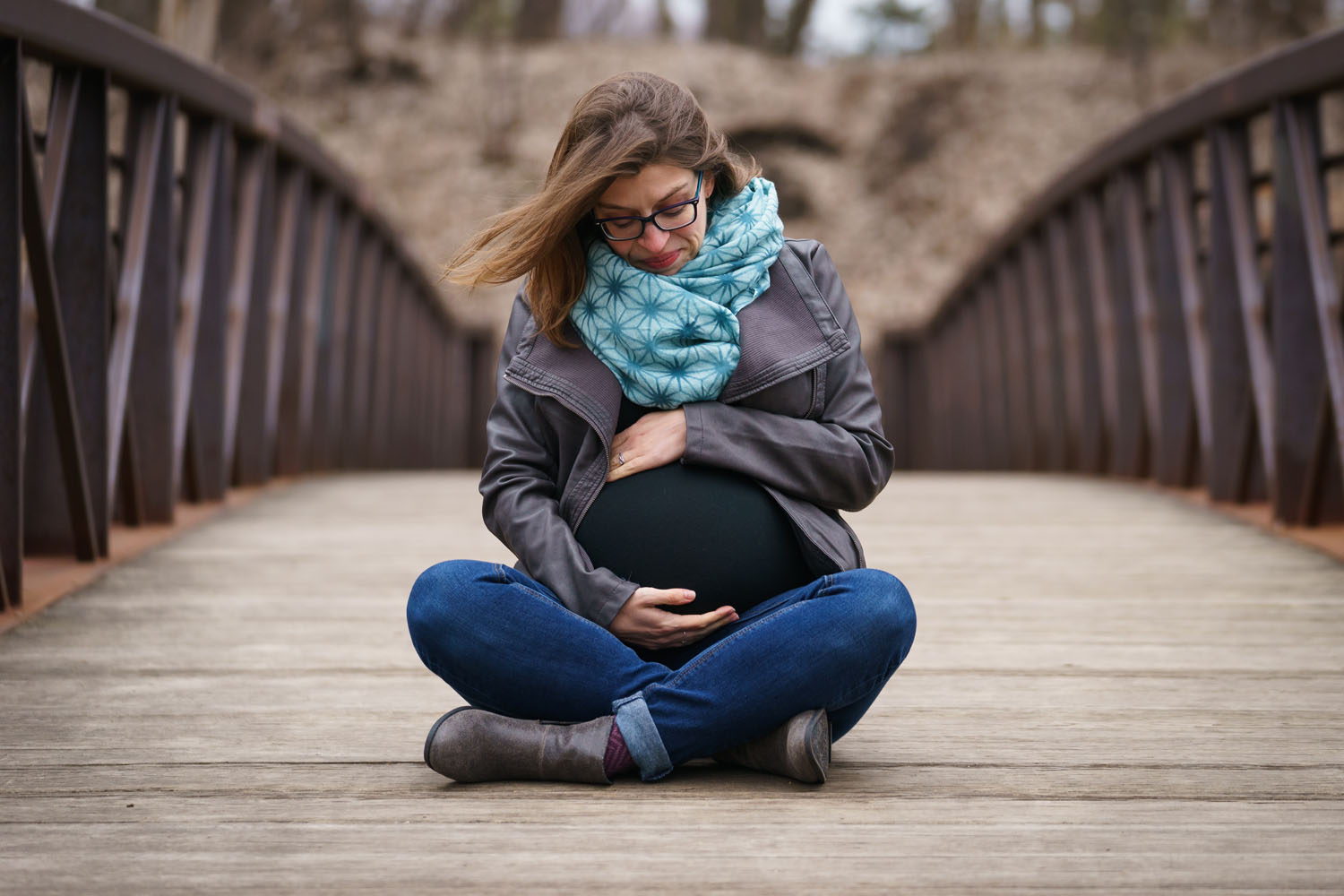 River Road Maternity Session - cross-legged bridge