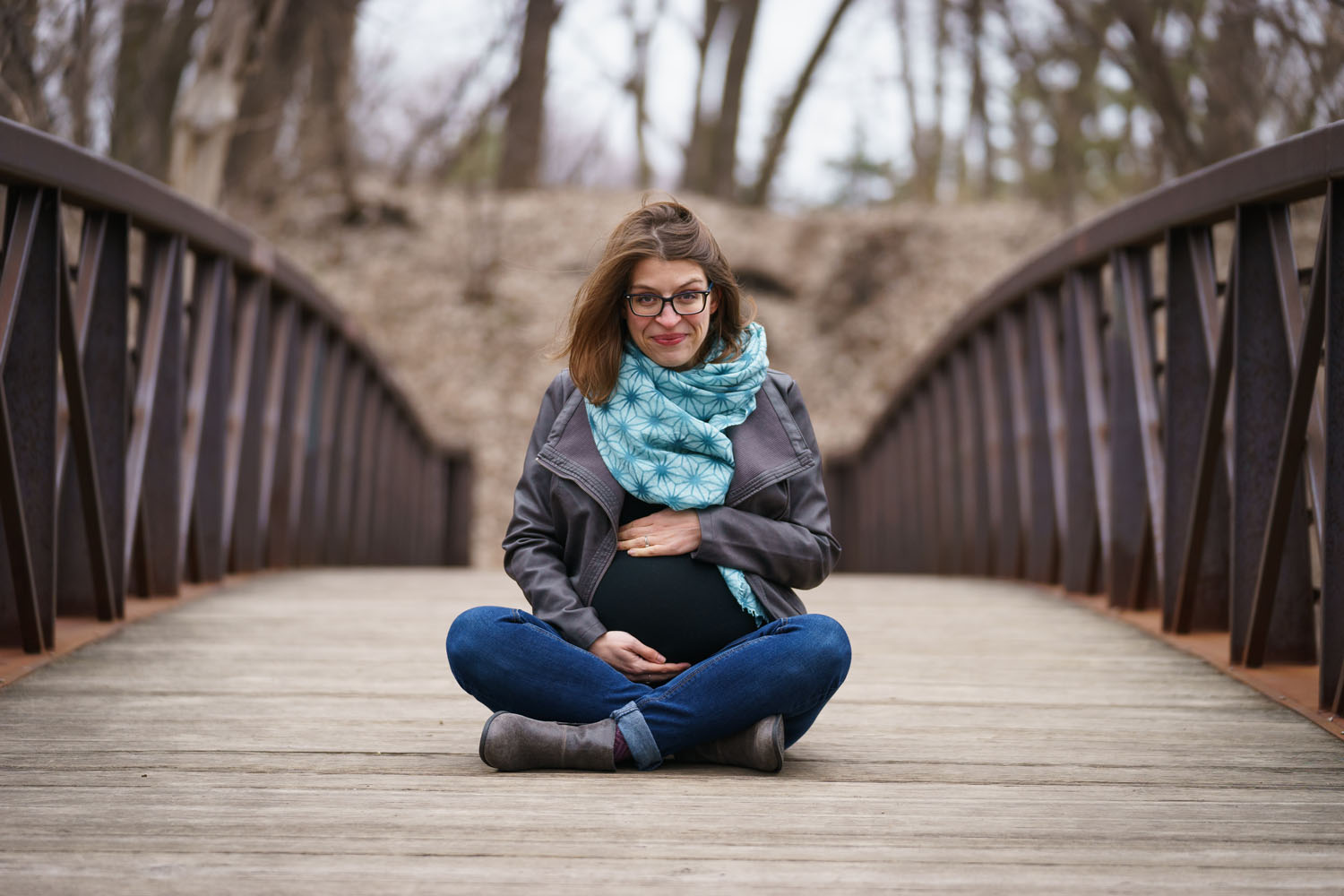 River Road Maternity Session - cross-legged bridge