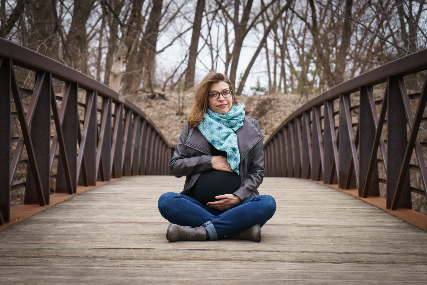 River Road Maternity Session - cross-legged bridge